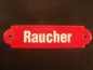 Preview: Emailleschild rot, mit weißer Schrift  "Raucher" ca. 20 x 5  cm.